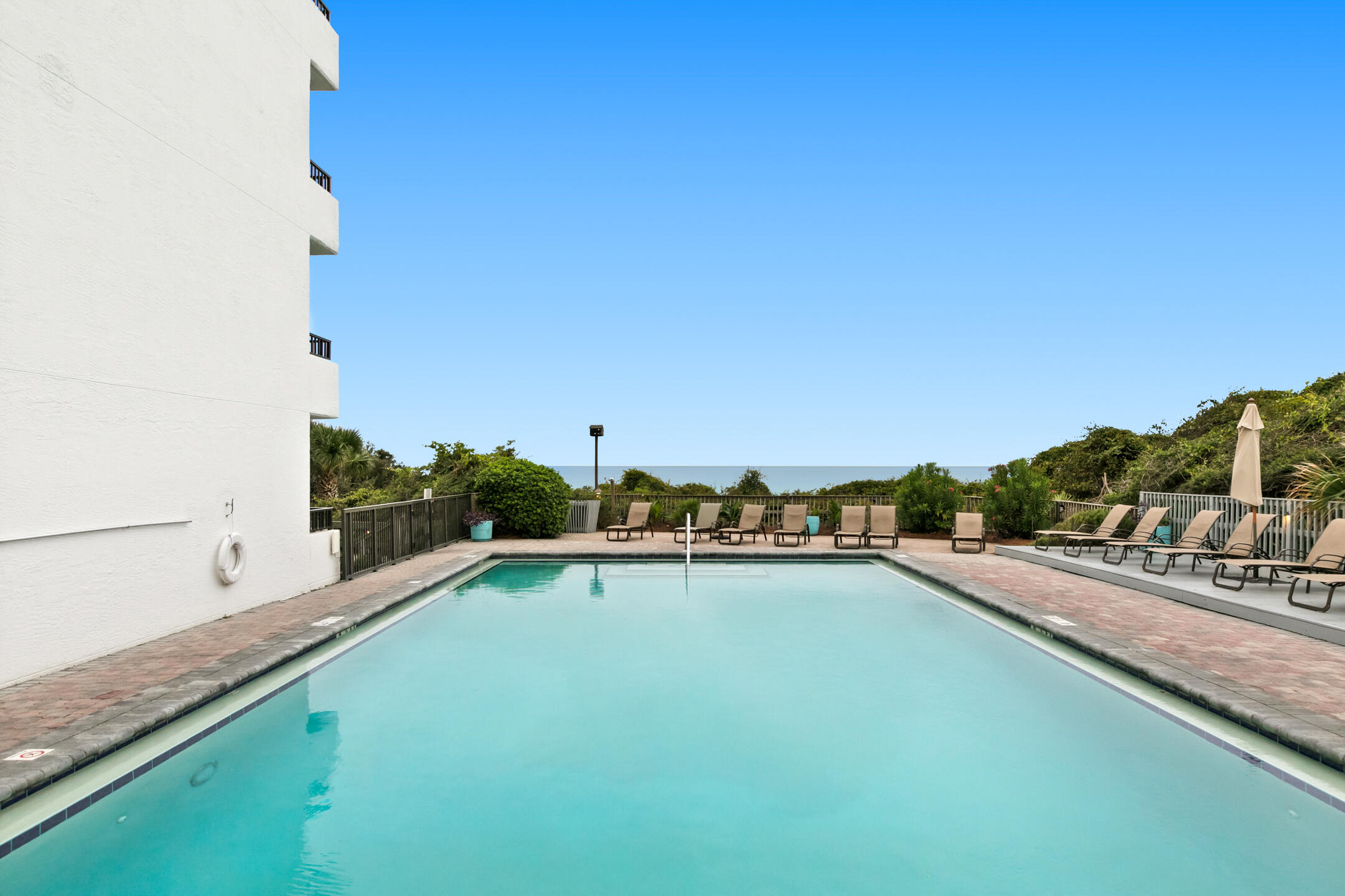4100 East County Highway 30A, Unit 1604 Santa Rosa Beach, FL 32459 - Photo 39 of 43 a view of a swimming pool with a chair
