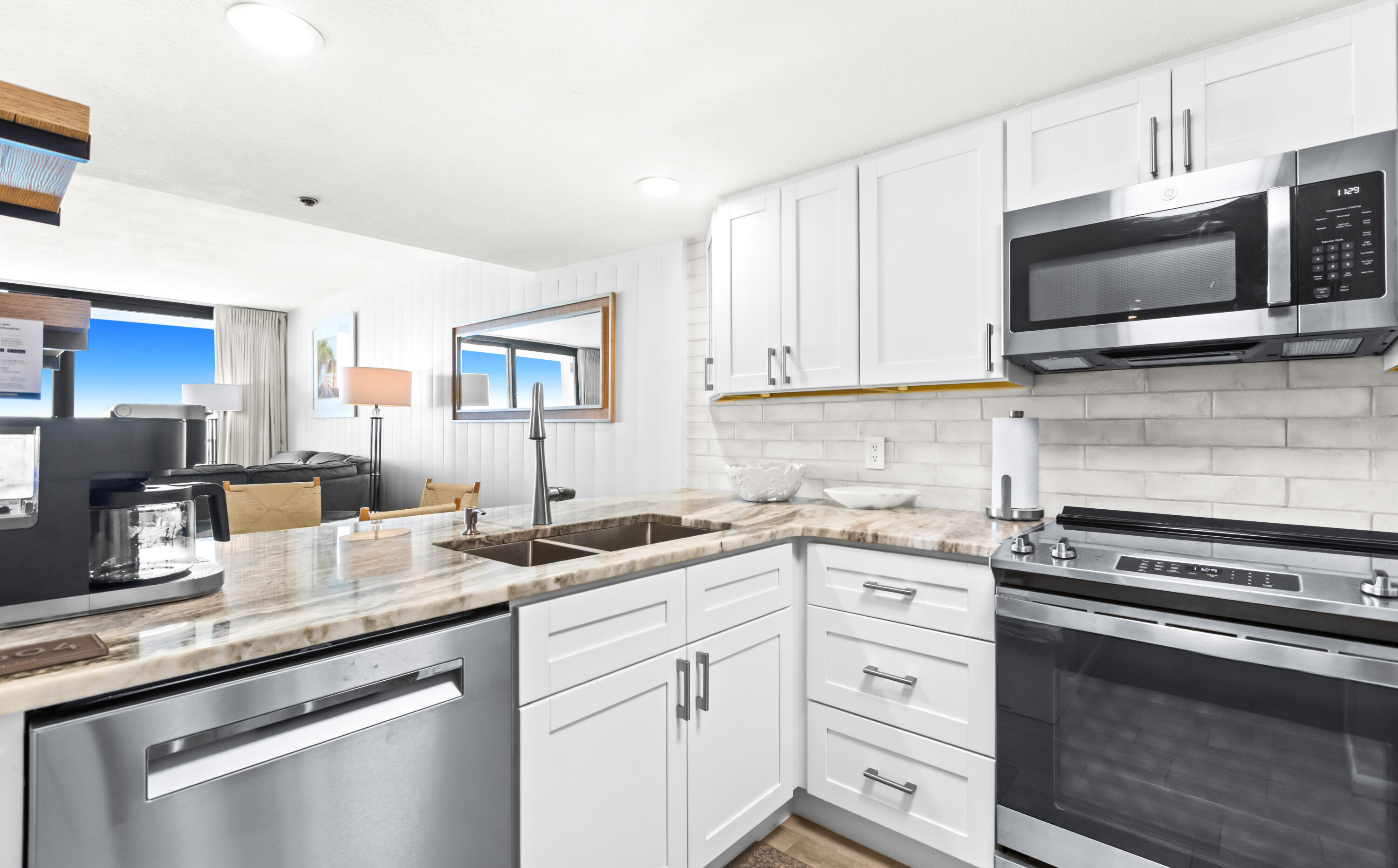 4100 East County Highway 30A, Unit 1604 Santa Rosa Beach, FL 32459 - Photo 10 of 43 a kitchen with appliances a sink and cabinets