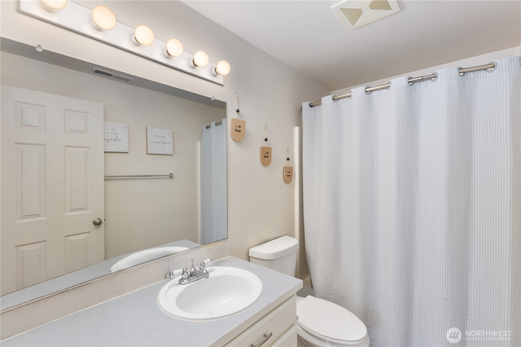 8305 Sweetbrier Loop Southeast Olympia, WA 98513 - Photo 25 of 40 a bathroom with a sink toilet and shower