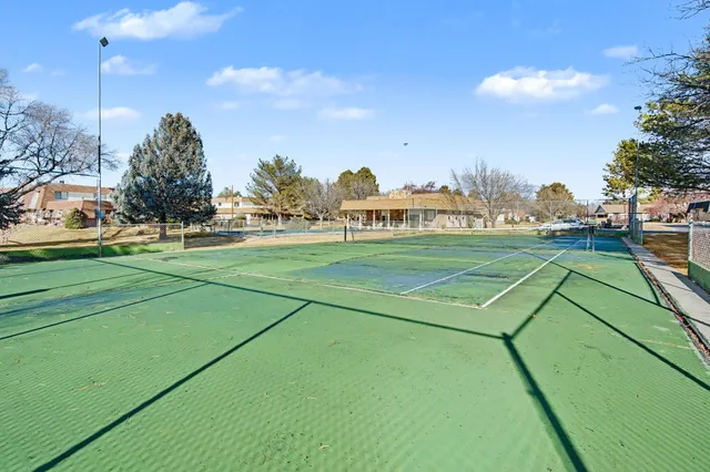 a view of an outdoor space and tennis court