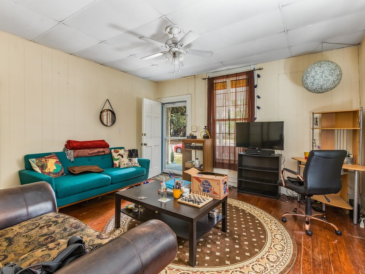 508 Tilden Street, Unit 1 Raleigh, NC 27605 - Photo 11 of 16 a living room with furniture and a flat screen tv