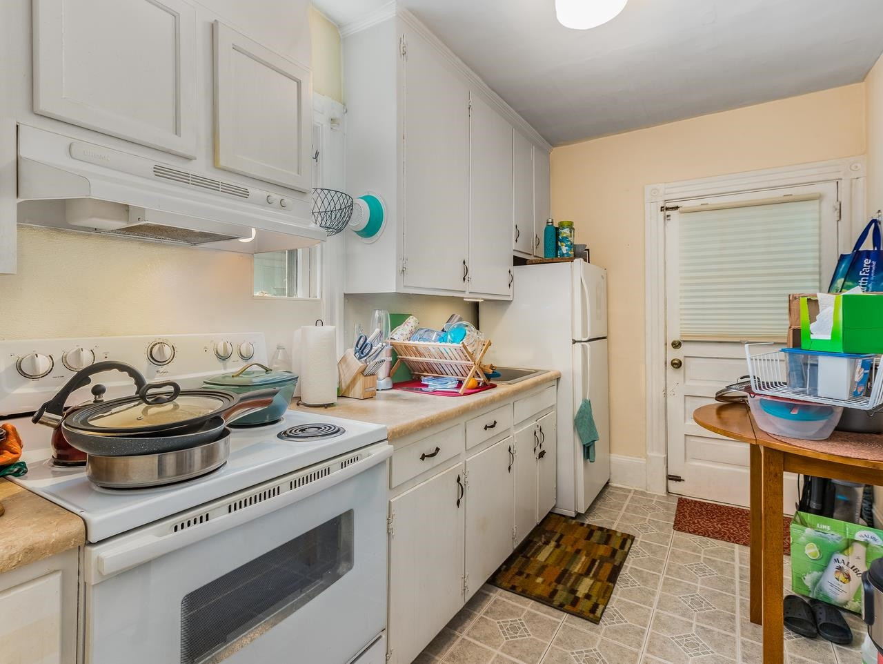 508 Tilden Street, Unit 1 Raleigh, NC 27605 - Photo 6 of 16 a kitchen with stainless steel appliances granite countertop a sink stove and cabinets