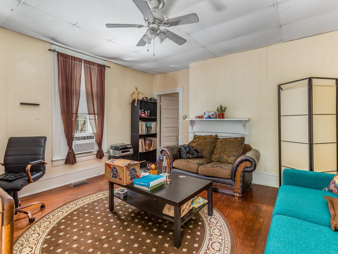 508 Tilden Street, Unit 1 Raleigh, NC 27605 - Photo 10 of 16 a living room with furniture a rug and a window