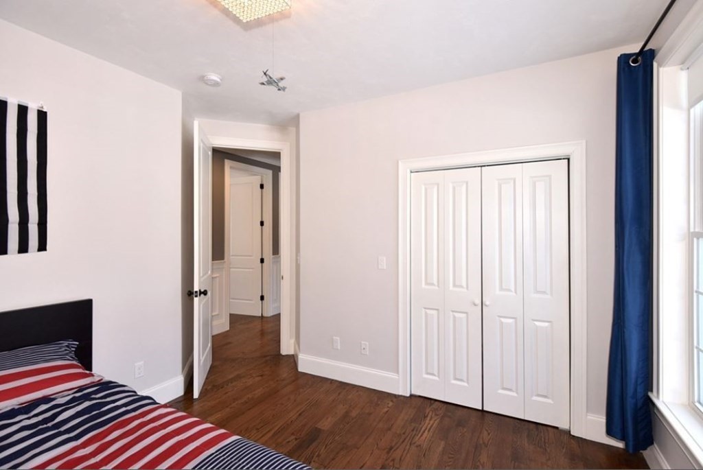 261 Main Street, Unit 1 Shrewsbury, MA 01545 - Photo 10 of 14 a view of bedroom with wooden floor