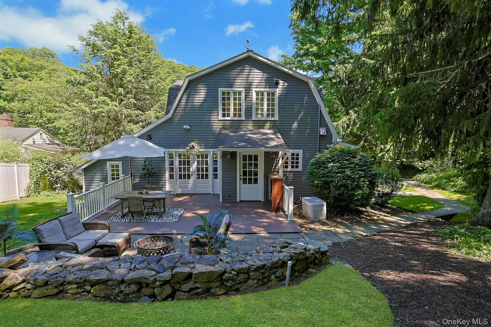 65 Douglas Road Chappaqua, NY 10514 - Photo 30 of 41 The spacious stone patio and charming walkway create a beautiful outdoor extension of the home.