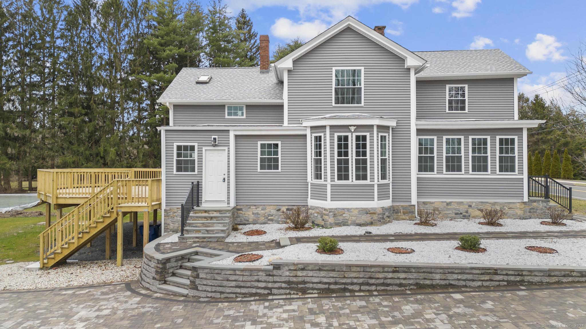 77 Prospect Hill Road Windsor, CT 06095 - Photo 1 of 1 a front view of a house with a patio
