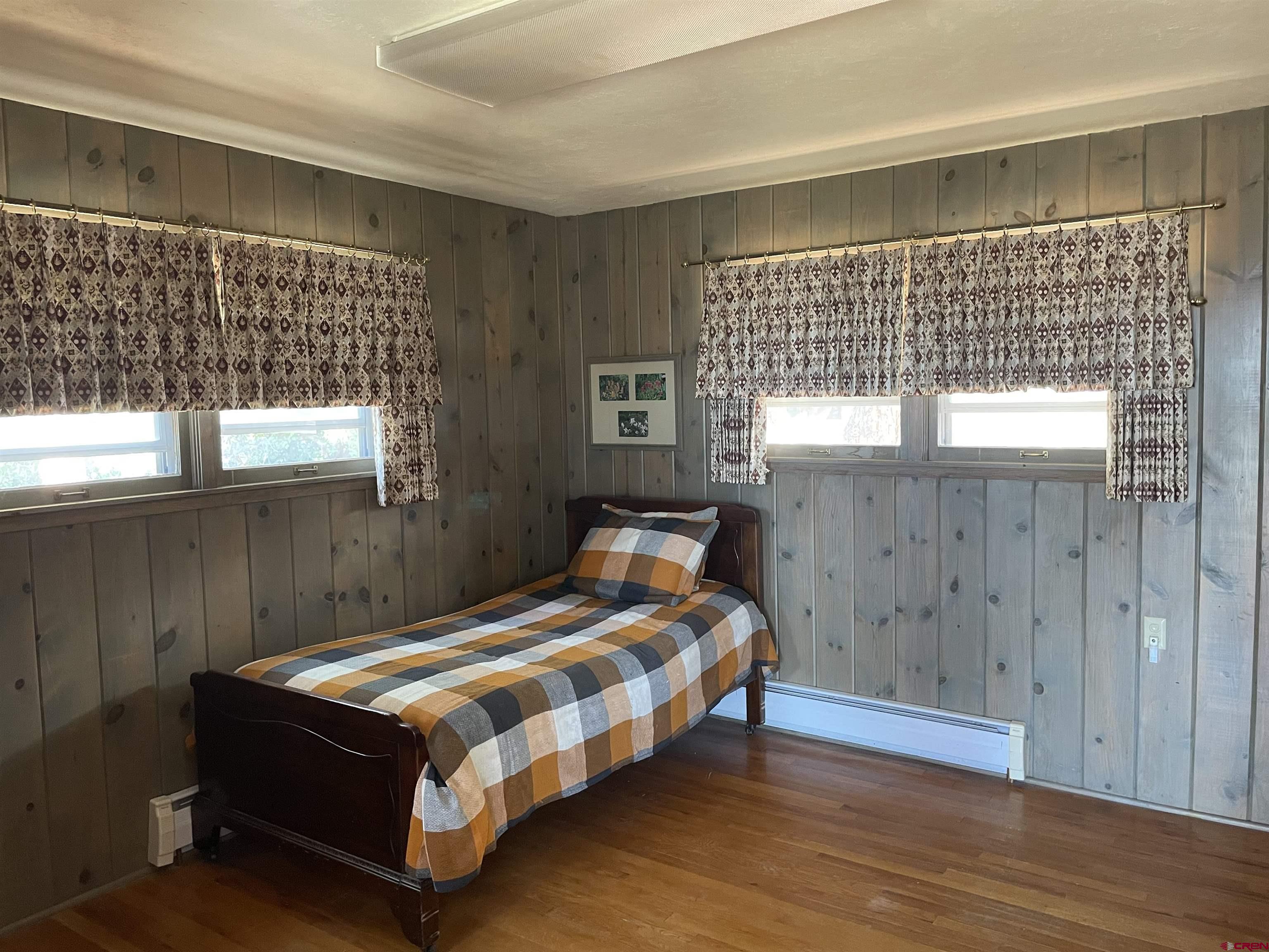 21439 2300th Road Cedaredge, CO 81413 - Photo 18 of 20 a bedroom with a bed and window
