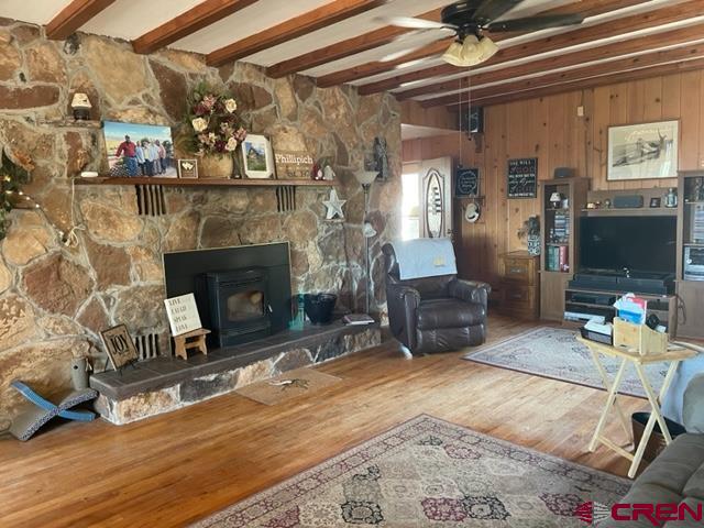 21439 2300th Road Cedaredge, CO 81413 - Photo 20 of 20 a living room with furniture and a fireplace