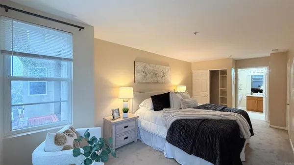 a bedroom with a bed and a window