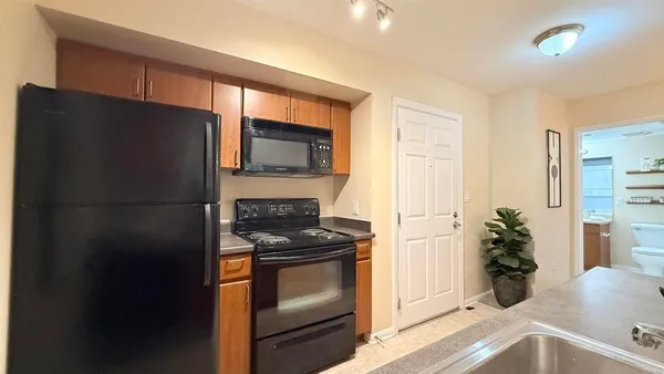 a kitchen with a refrigerator stove and a sink