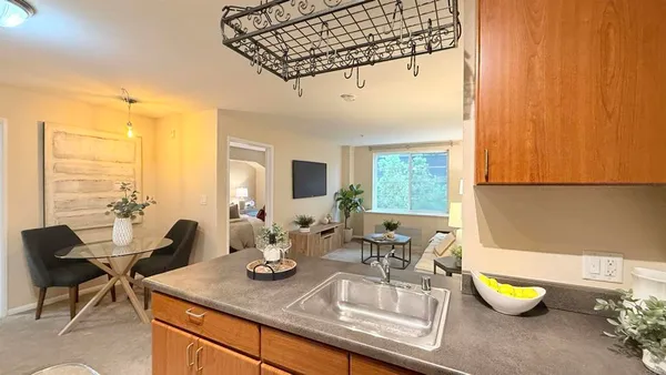 a kitchen with a sink and a counter top space
