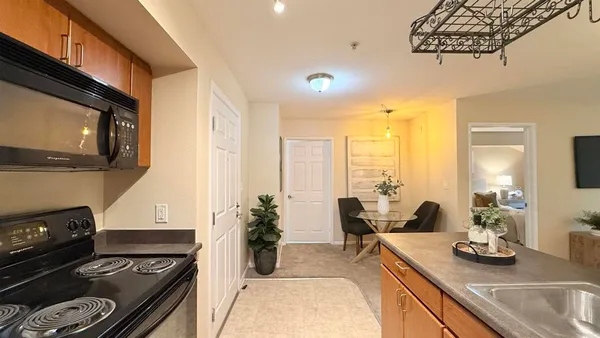 a kitchen with a stove and a sink