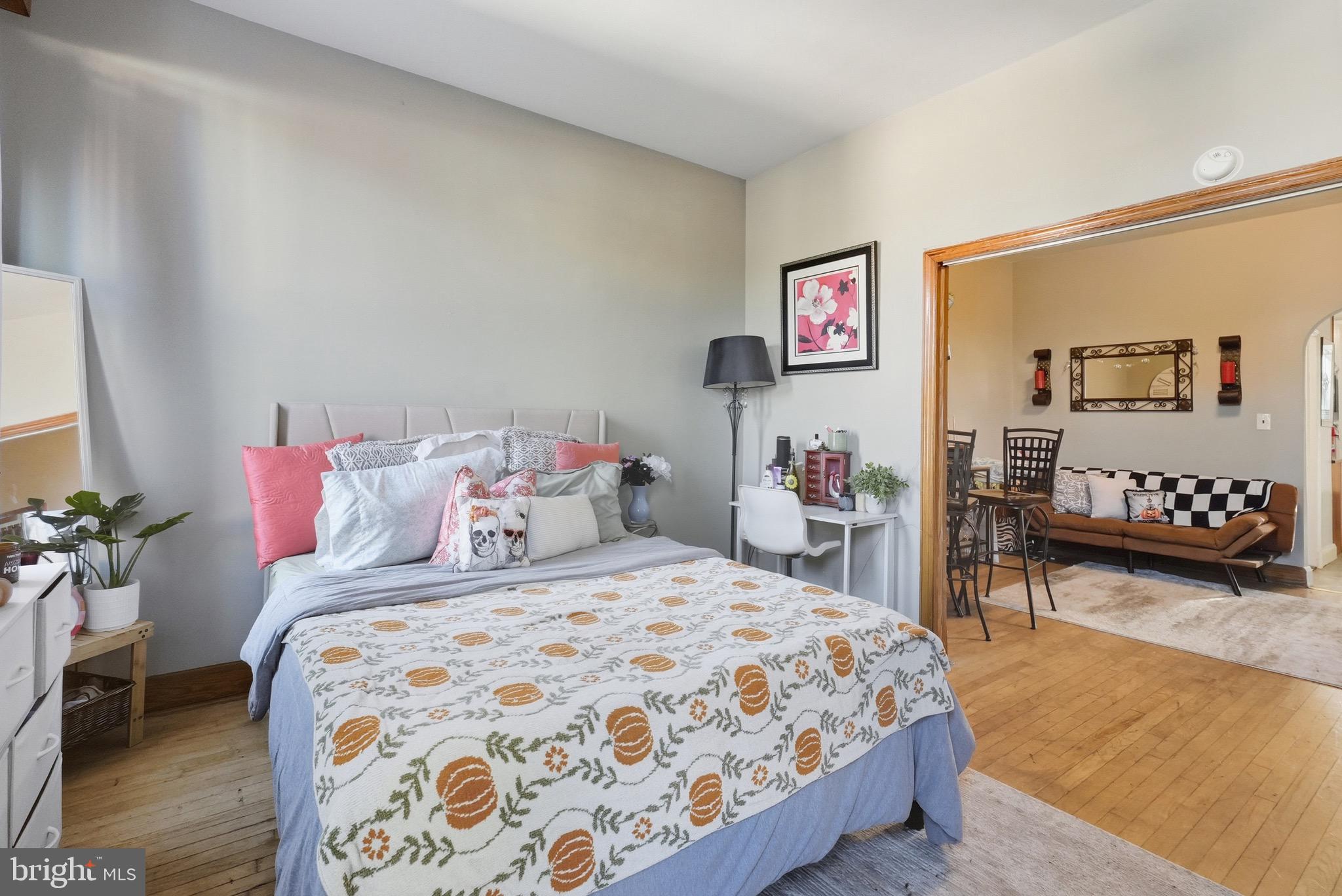 1412 Light Street, Unit 3 Baltimore, MD 21230 - Photo 13 of 23 a bedroom with a bed and a table