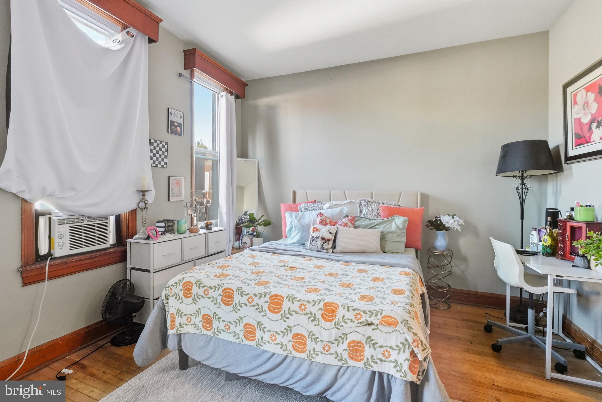 1412 Light Street, Unit 3 Baltimore, MD 21230 - Photo 14 of 23 a bedroom with a bed dresser and a window