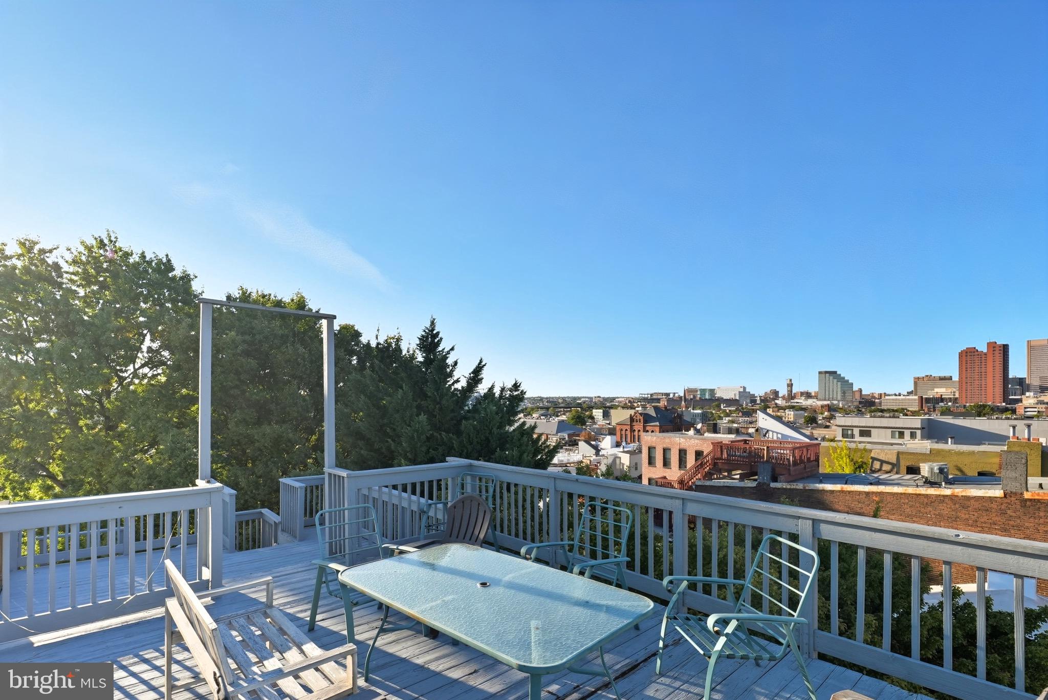 1412 Light Street, Unit 3 Baltimore, MD 21230 - Photo 21 of 23 a view of a balcony with two chairs and wooden floor