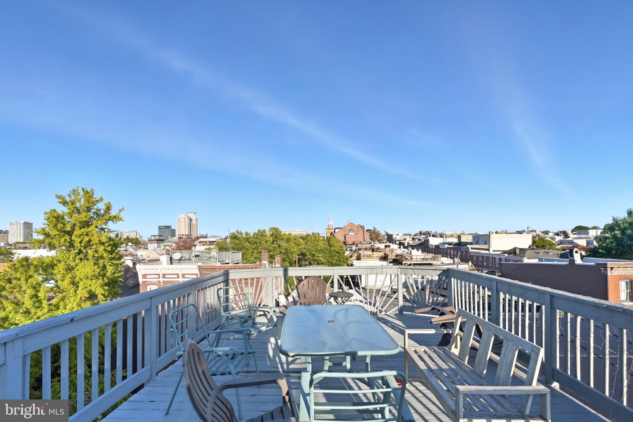 1412 Light Street, Unit 3 Baltimore, MD 21230 - Photo 22 of 23 a view of a balcony with table and chairs
