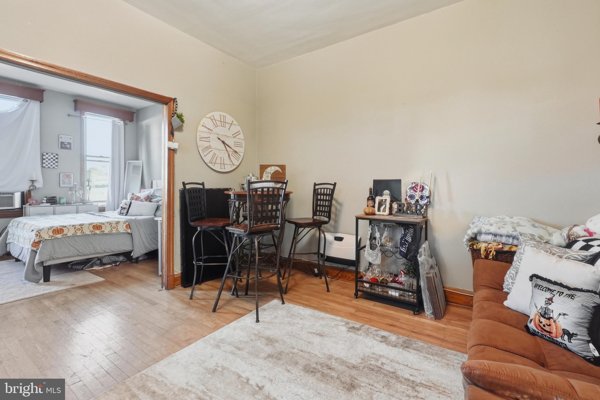 1412 Light Street, Unit 3 Baltimore, MD 21230 - Photo 7 of 23 a living room with furniture and a flat screen tv