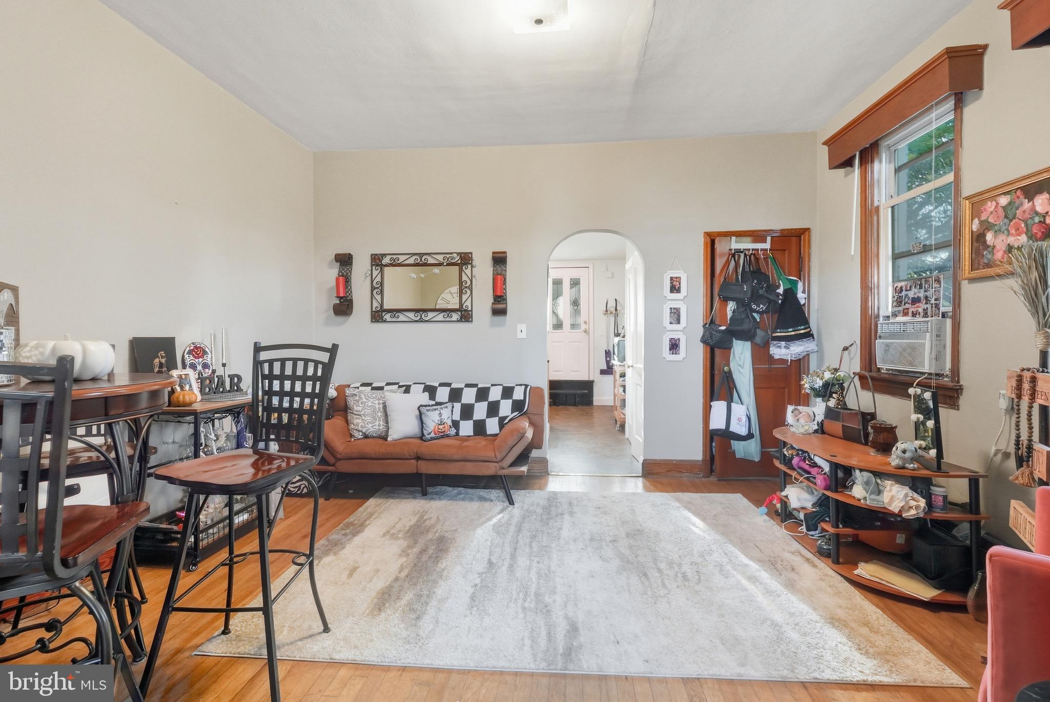 1412 Light Street, Unit 3 Baltimore, MD 21230 - Photo 9 of 23 a living room with furniture and a wooden floor