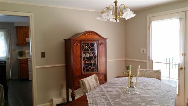 29 Gale Road Charlton, MA 01507 - Photo 7 of 15 a view of a dining room with furniture a chandelier and wooden floor