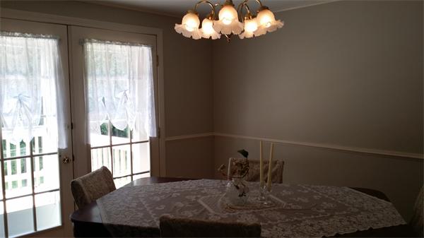 29 Gale Road Charlton, MA 01507 - Photo 8 of 15 a view of a dining room with furniture a chandelier and wooden floor