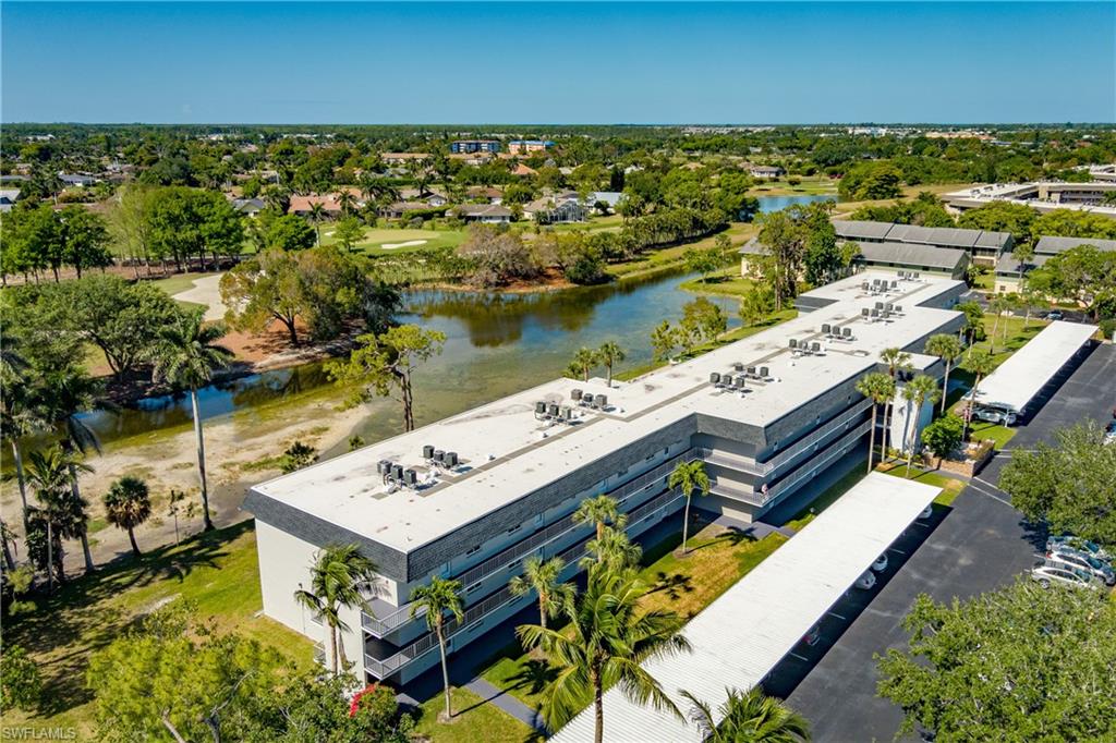 5515 Rattlesnake Hammock Road, Unit 205 Naples, FL 34113 - Photo 29 of 46 Bird's eye view featuring view of golf course and a water view