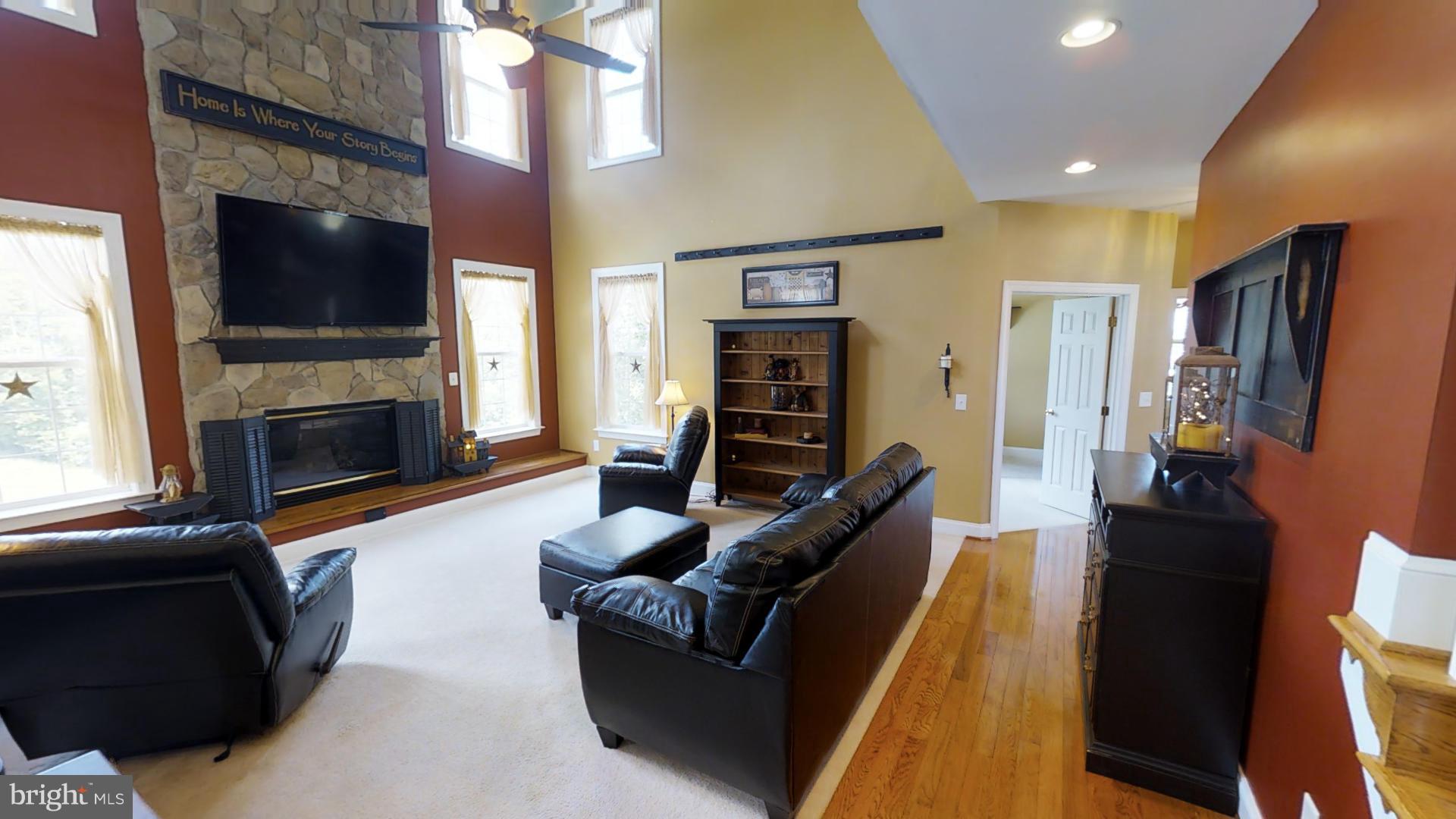 283 Rippling Waters Way Falling Waters, WV 25419 - Photo 13 of 30 a living room with furniture fireplace and flat screen tv