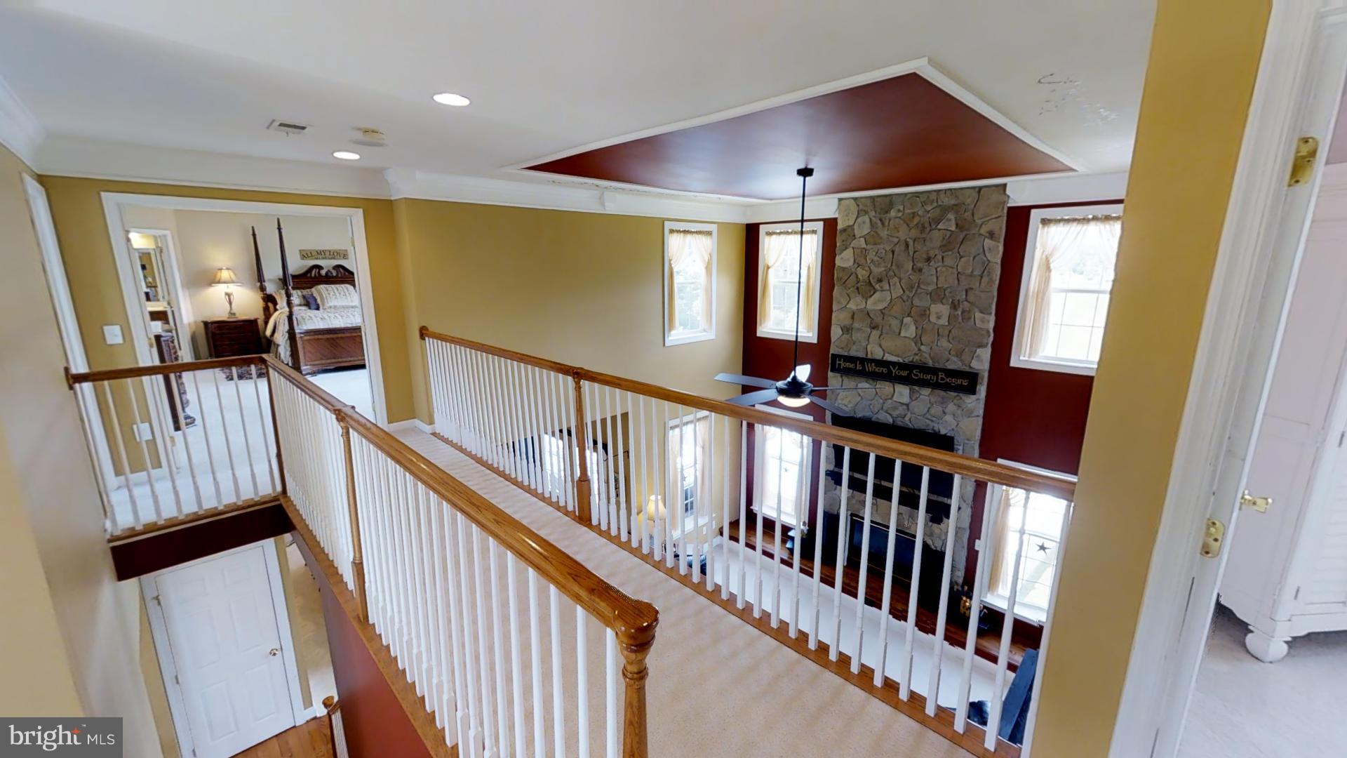 283 Rippling Waters Way Falling Waters, WV 25419 - Photo 21 of 30 a view of an entryway wooden floor and stairs