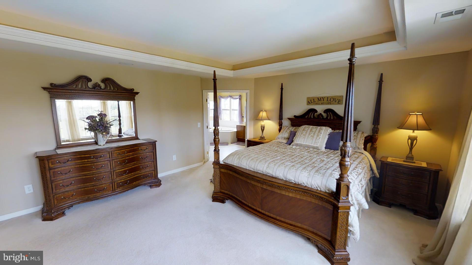 283 Rippling Waters Way Falling Waters, WV 25419 - Photo 23 of 30 a bedroom with a bed and wooden floor