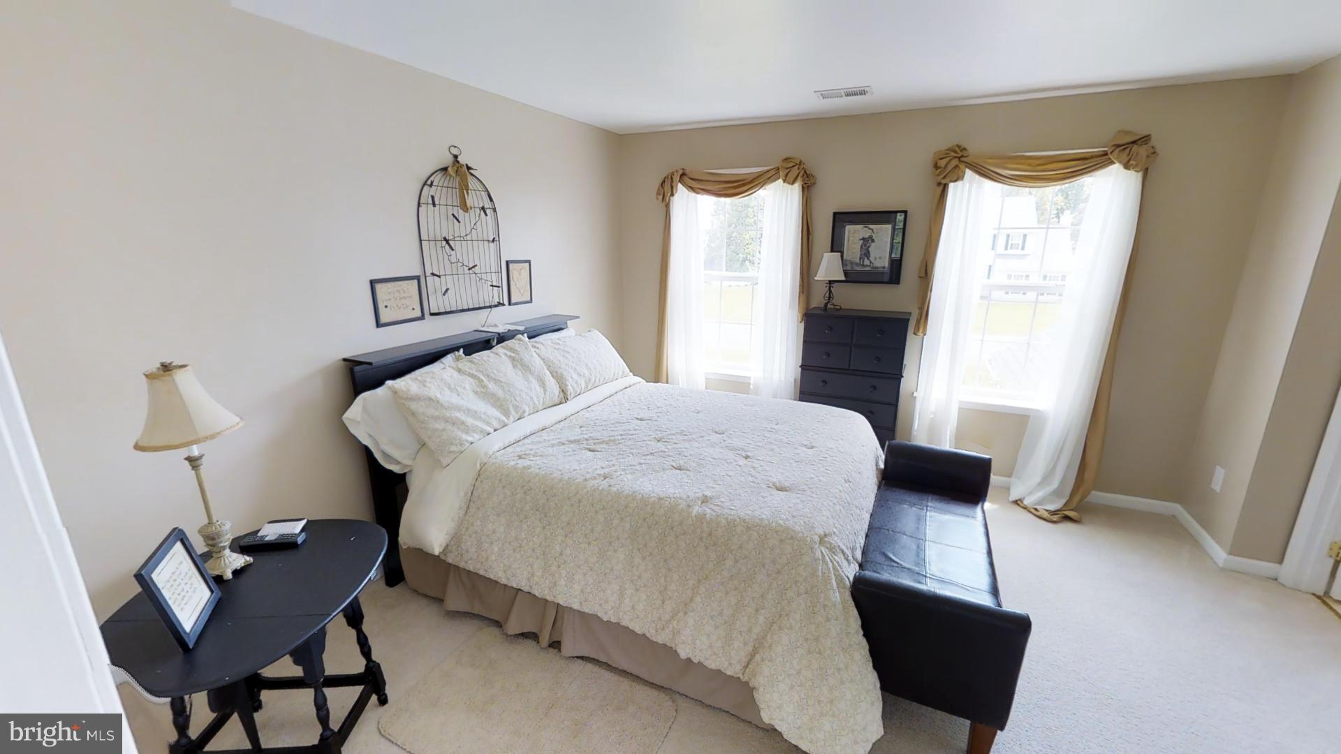 283 Rippling Waters Way Falling Waters, WV 25419 - Photo 26 of 30 a bedroom with a bed and a chair in it