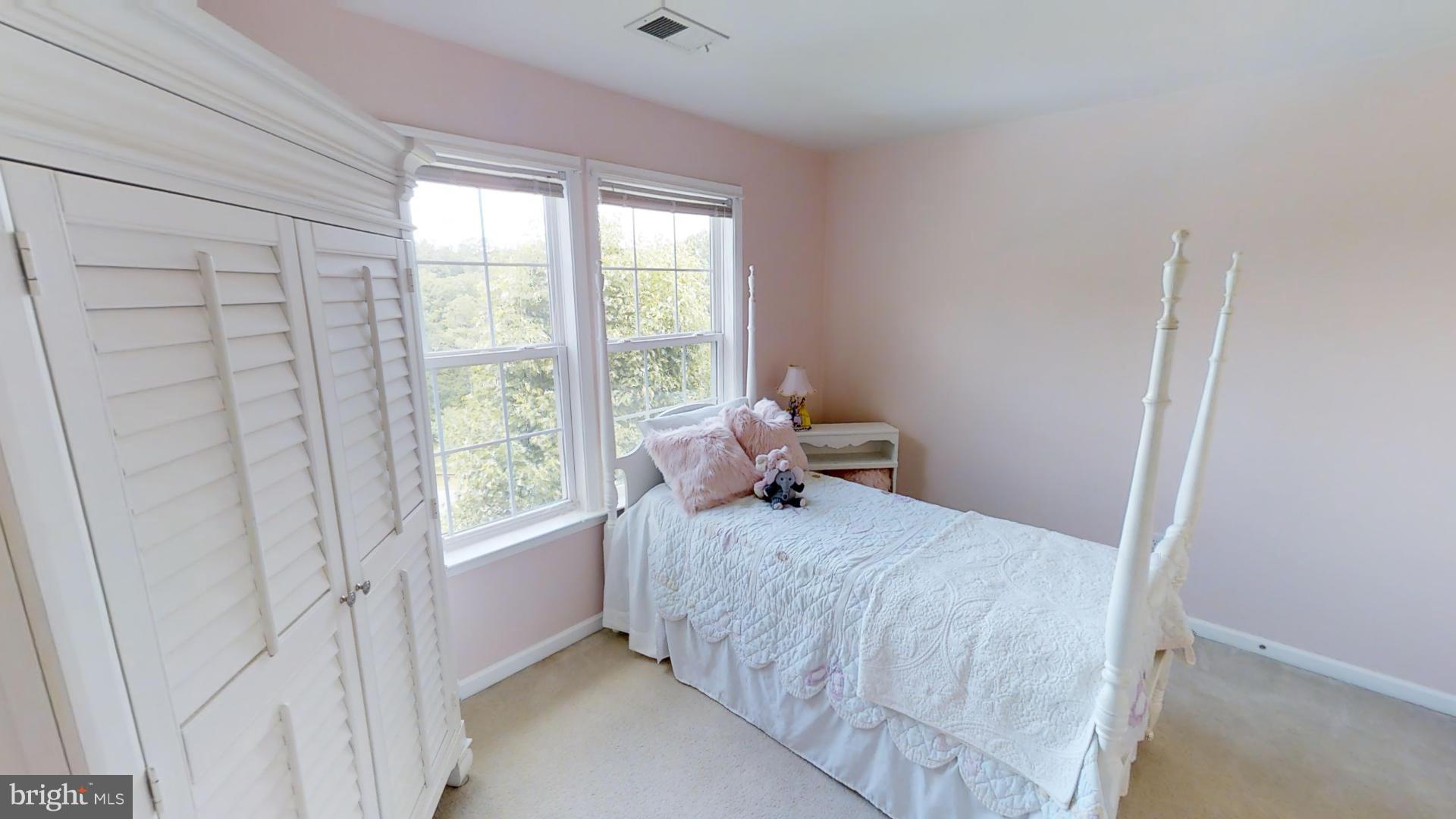283 Rippling Waters Way Falling Waters, WV 25419 - Photo 27 of 30 a bedroom with a bed and a window