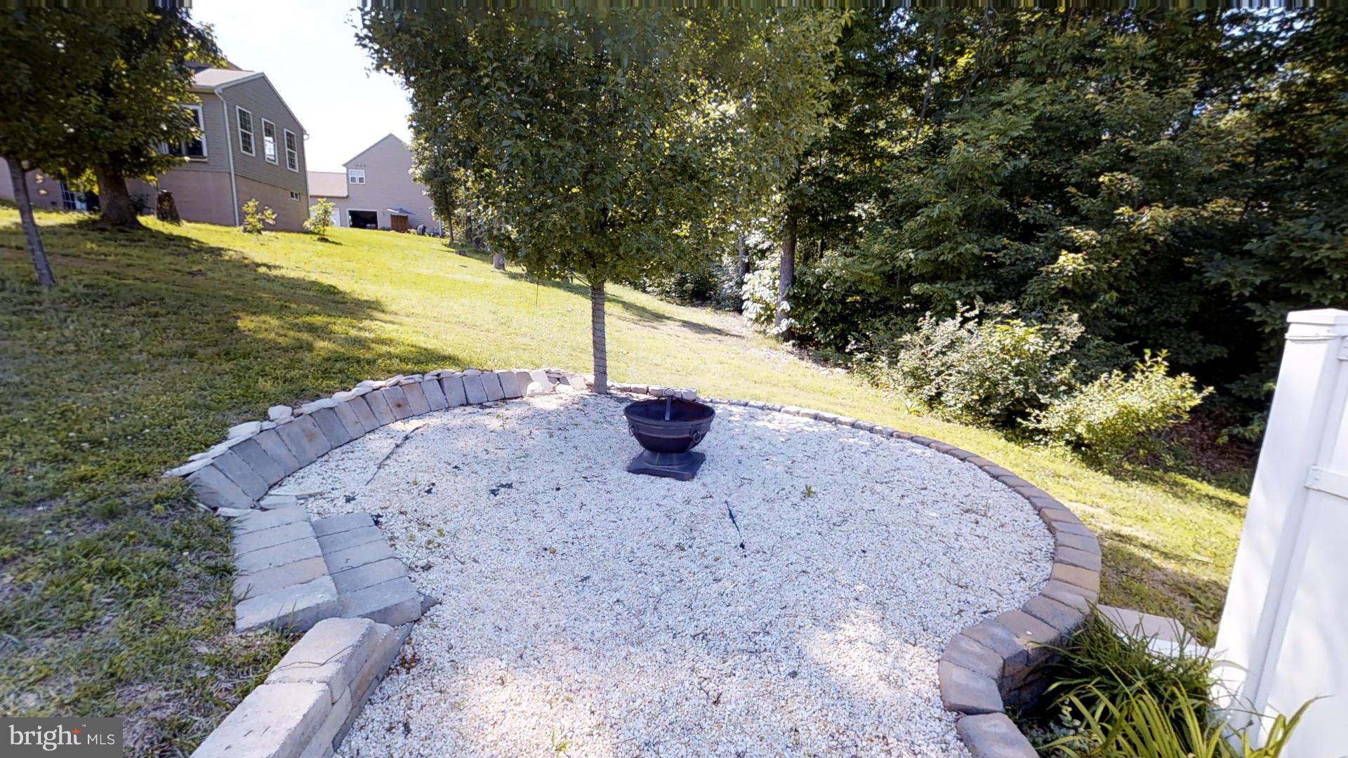 283 Rippling Waters Way Falling Waters, WV 25419 - Photo 30 of 30 a view of a yard with a fountain