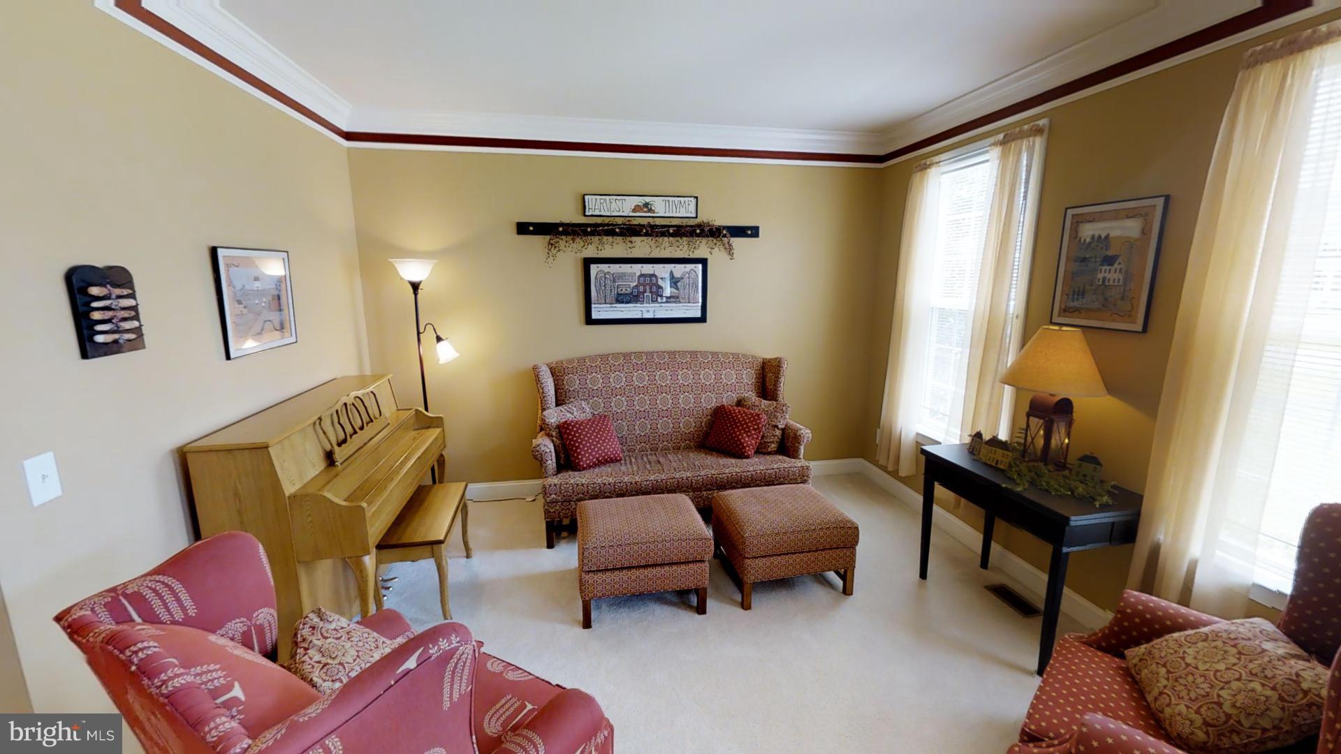 283 Rippling Waters Way Falling Waters, WV 25419 - Photo 8 of 30 a living room with furniture and a window