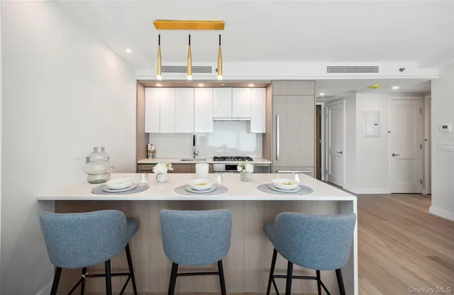 a dining table with chairs and wooden floor