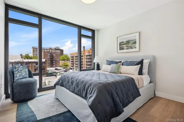 a bedroom with a large bed and a couch