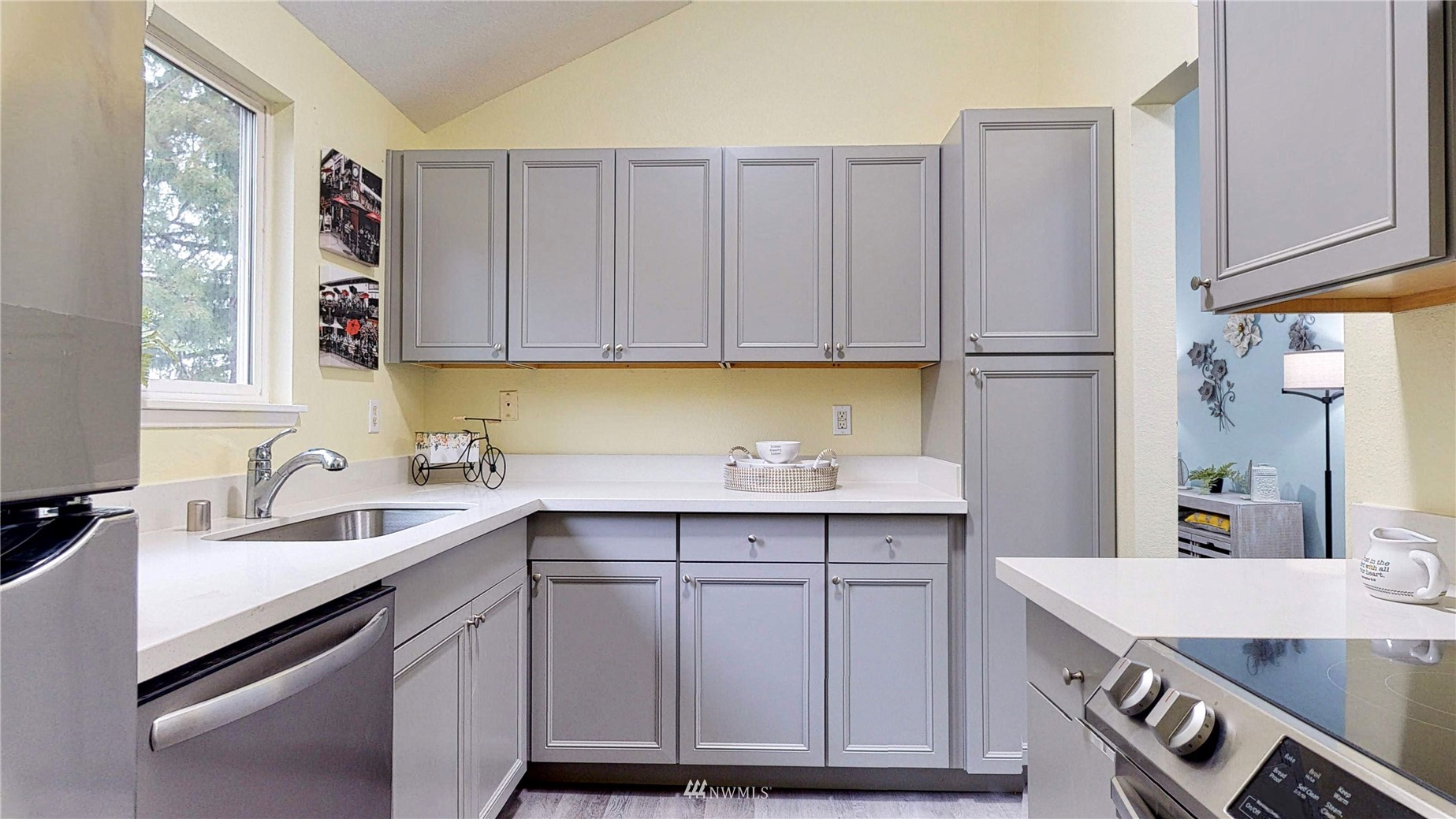 820 Cady Road, Unit C304 Everett, WA 98203 - Photo 7 of 23 a kitchen with a sink cabinets and window