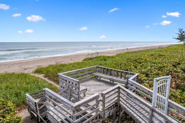 a view of a balcony with an ocean