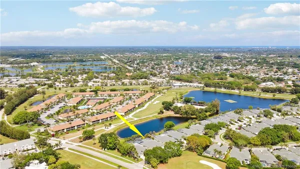 an aerial view of residential building with ocean view