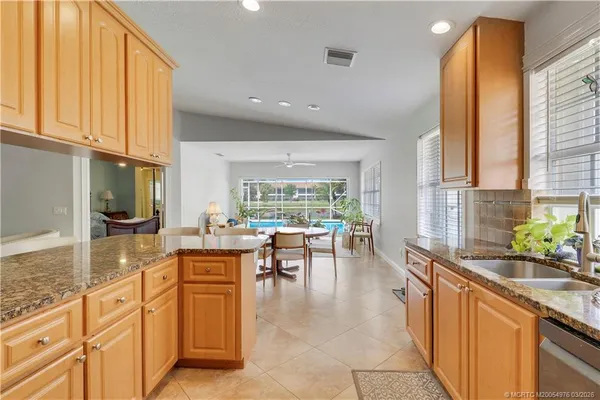 a kitchen with lots of counter top space and living room