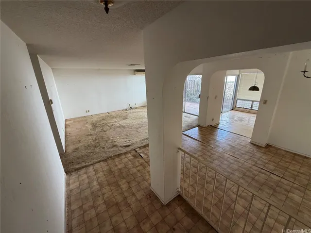 a view of a hallway view with wooden floor and staircase