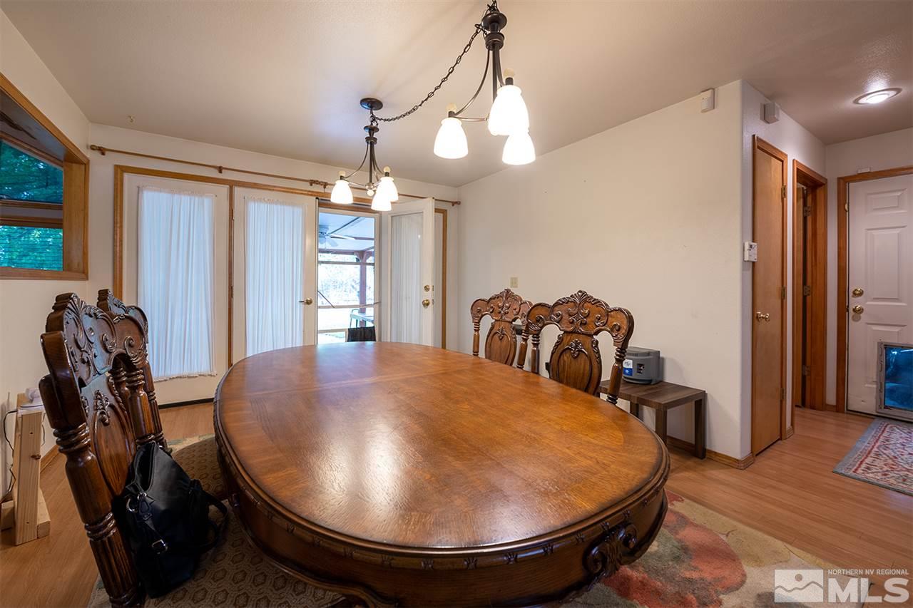 3318 Bottom Road Fallon, NV 89406 - Photo 4 of 23 a view of a dining room with furniture and wooden floor