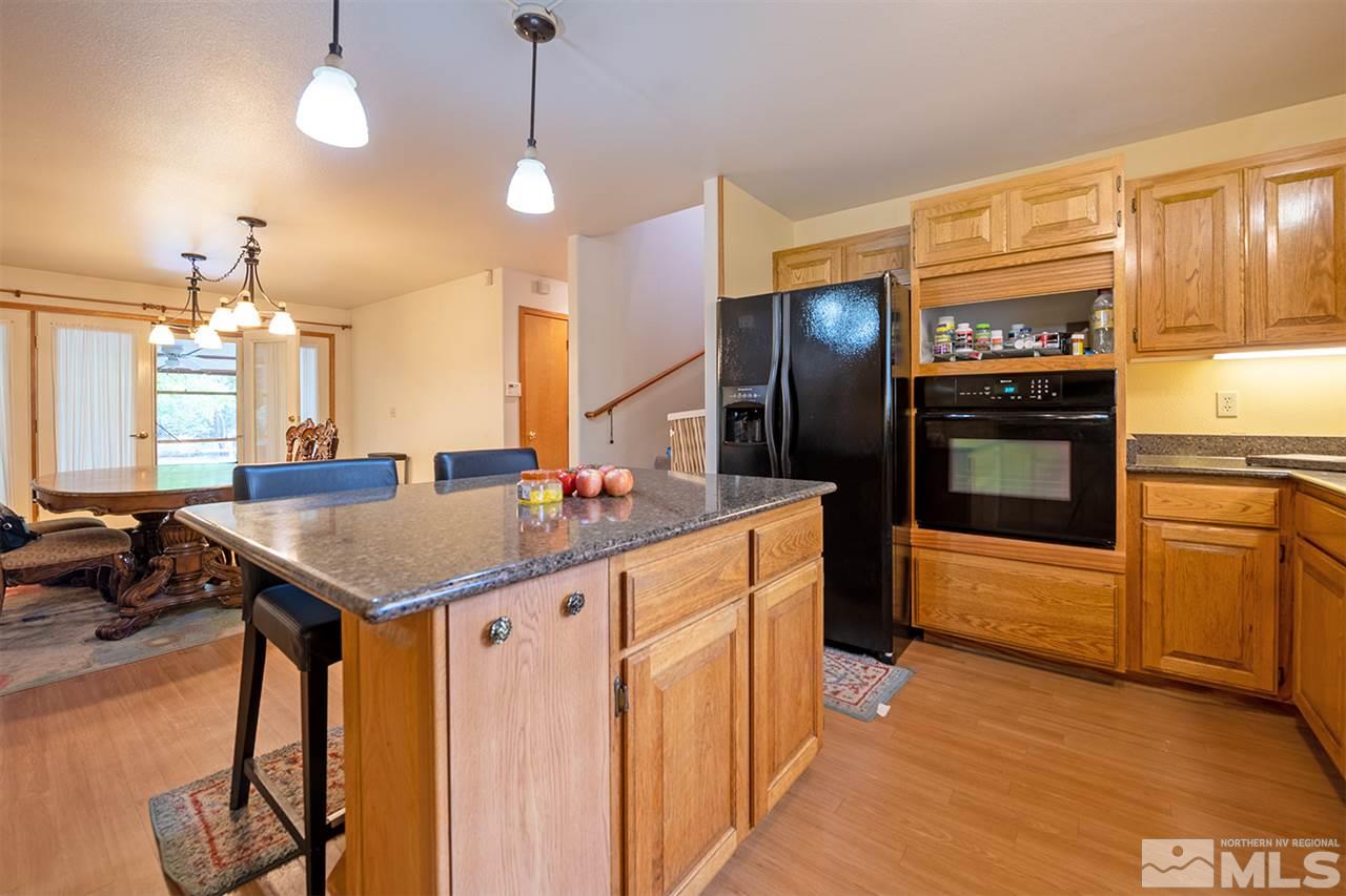 3318 Bottom Road Fallon, NV 89406 - Photo 5 of 23 a kitchen with a stove a refrigerator and a stove