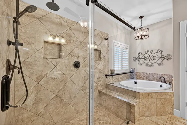 a bathroom with a sink a mirror and shower