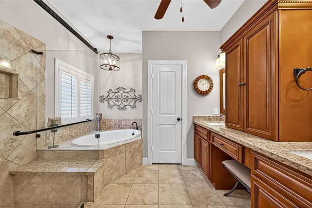 a spacious bathroom with a sink and a mirror