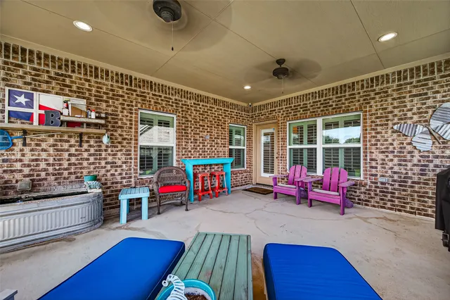 a living room with furniture stairs and a flat screen tv