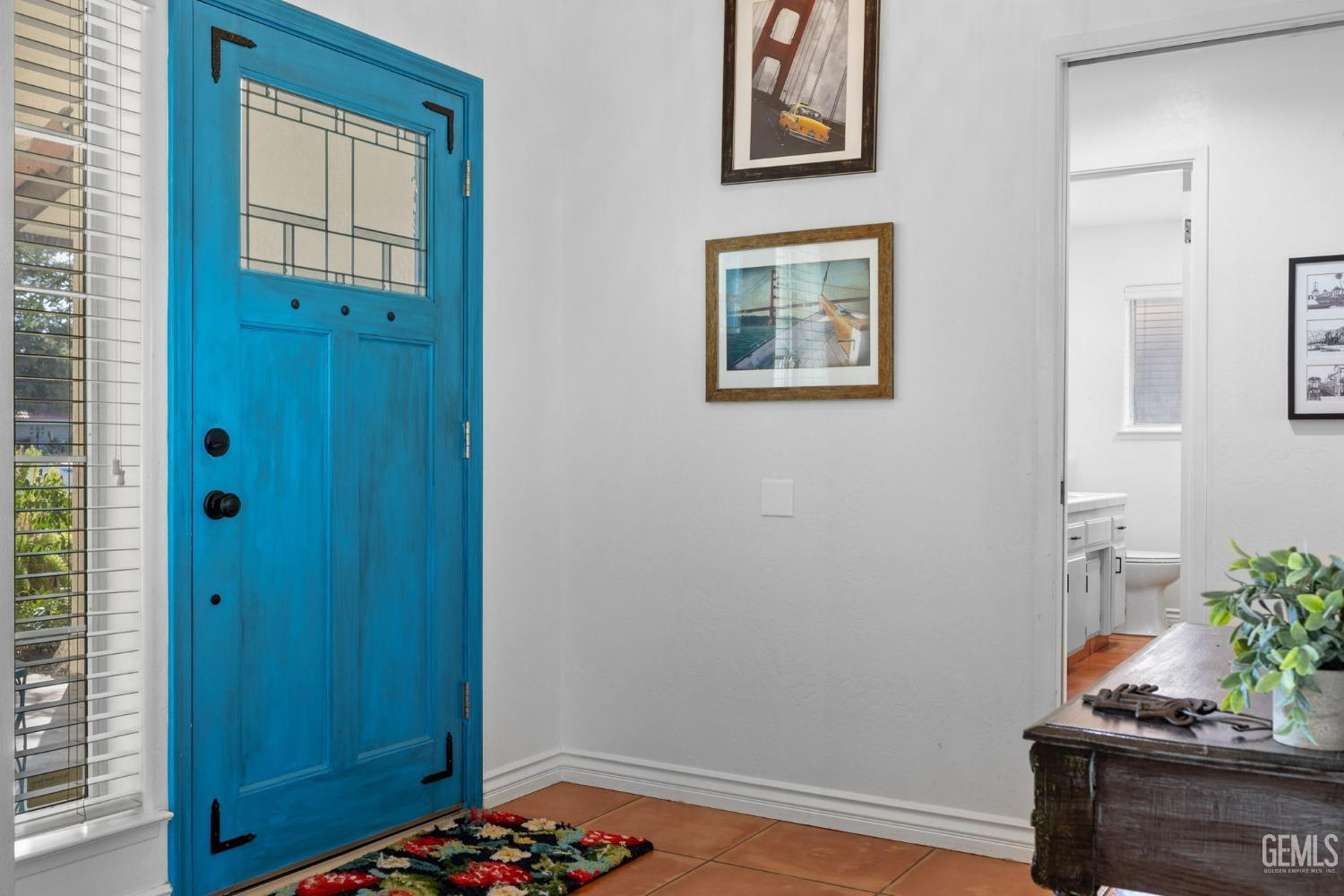 Undisclosed Address Bakersfield, CA 93311 - Photo 13 of 69 a room with painting on the wall and a potted plant