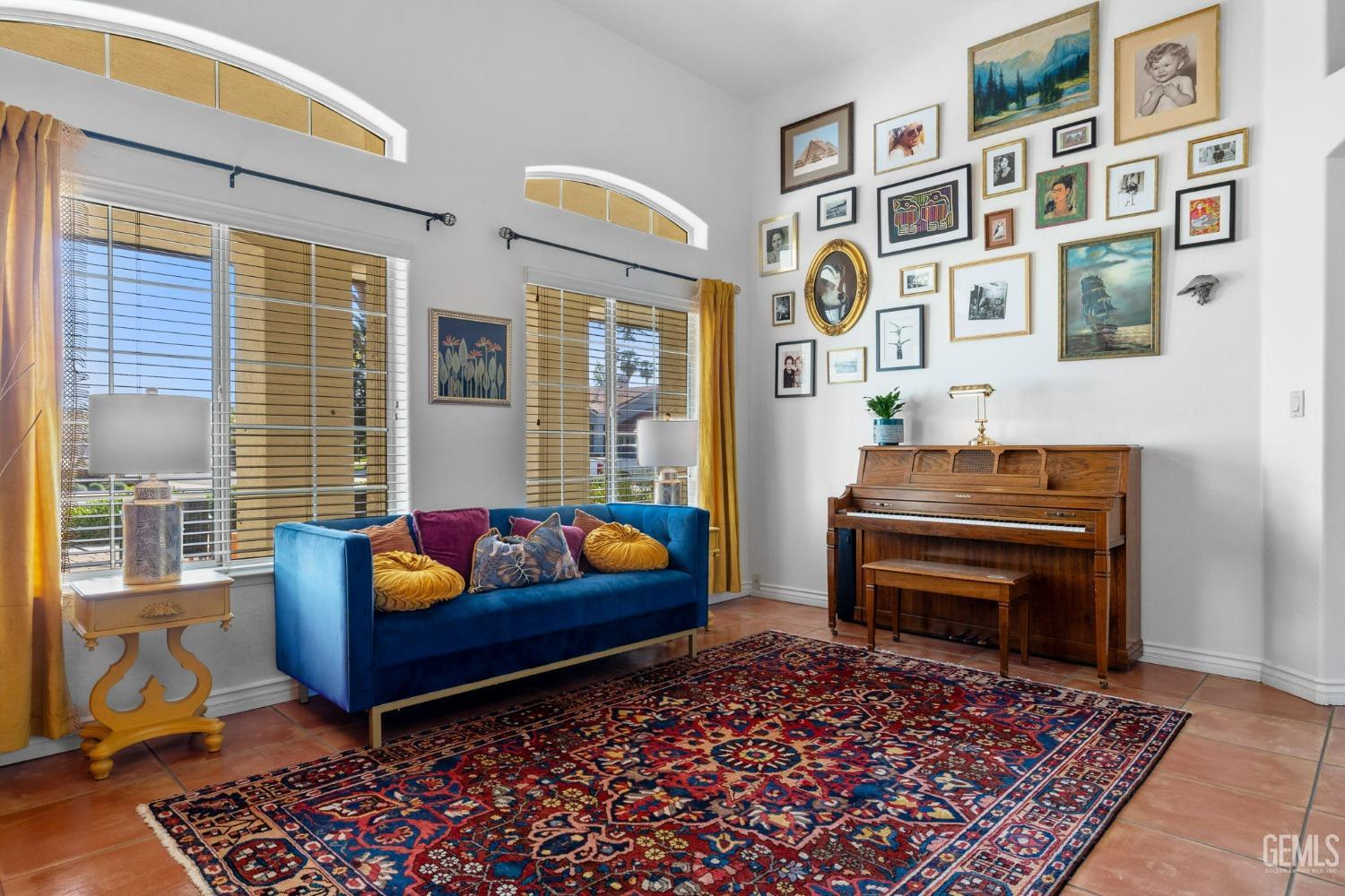 Undisclosed Address Bakersfield, CA 93311 - Photo 15 of 69 a living room with furniture a rug and a piano