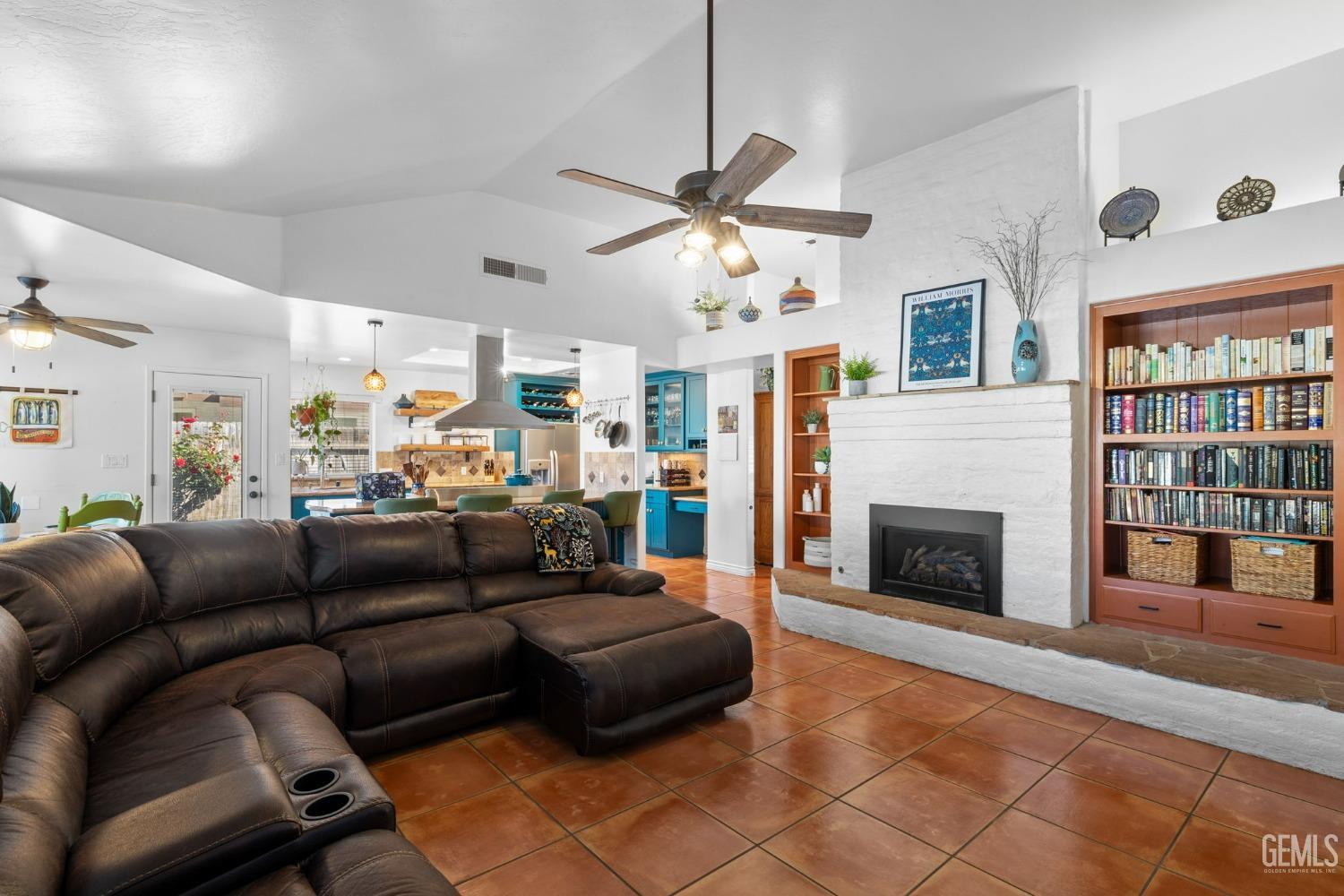 Undisclosed Address Bakersfield, CA 93311 - Photo 24 of 69 a living room with furniture and a fireplace