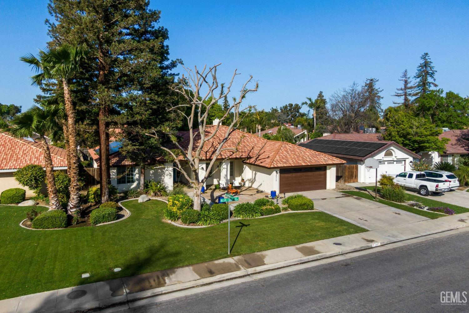 Undisclosed Address Bakersfield, CA 93311 - Photo 3 of 69 front view of a house with a yard
