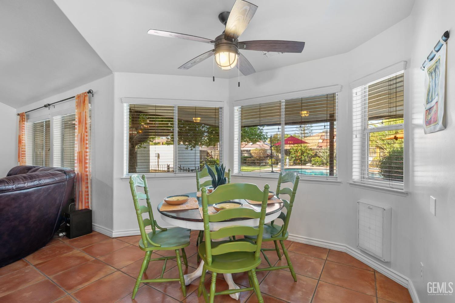 Undisclosed Address Bakersfield, CA 93311 - Photo 37 of 69 a dining room with furniture a chandelier and a rug