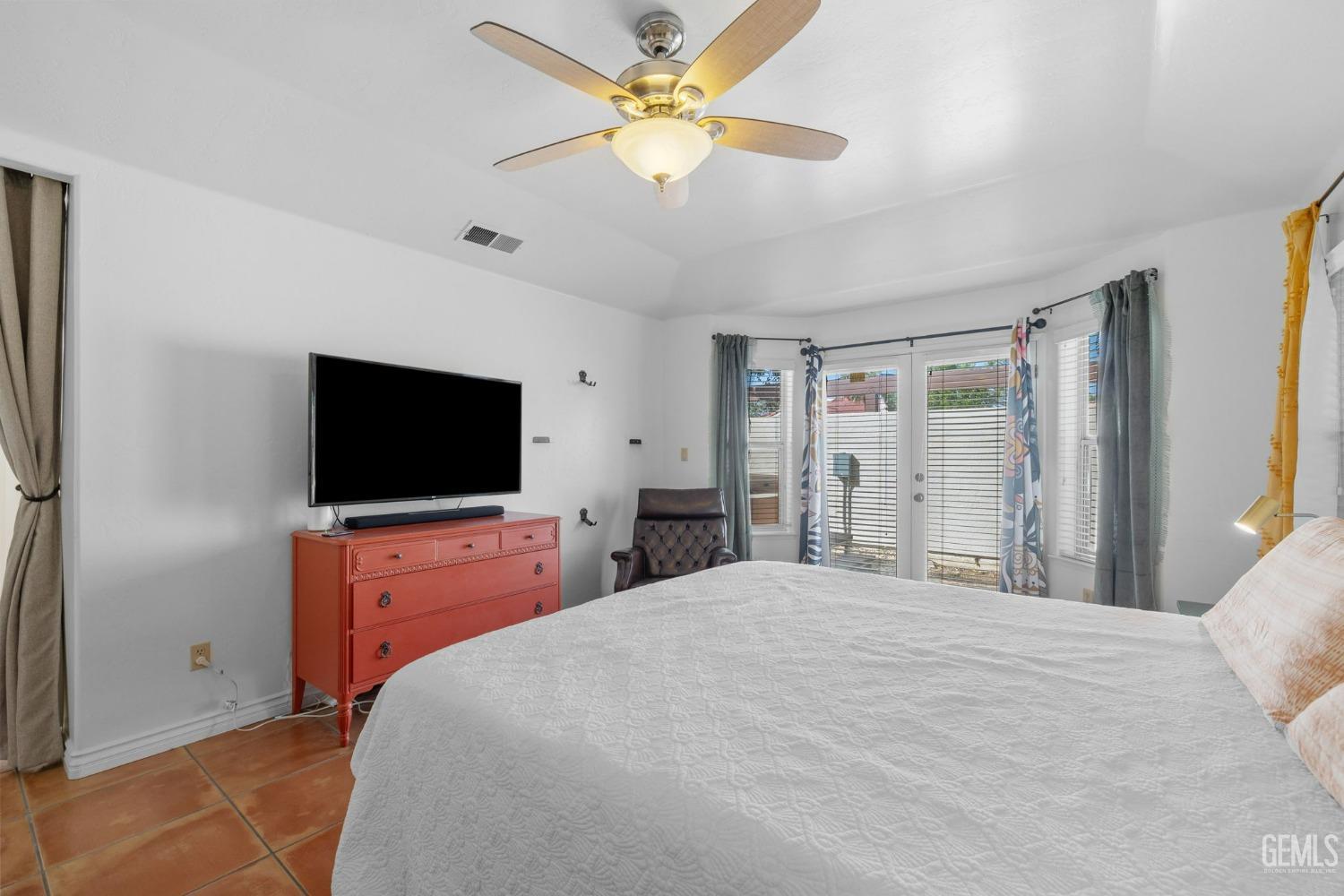 Undisclosed Address Bakersfield, CA 93311 - Photo 42 of 69 a bedroom with a bed and a flat screen tv